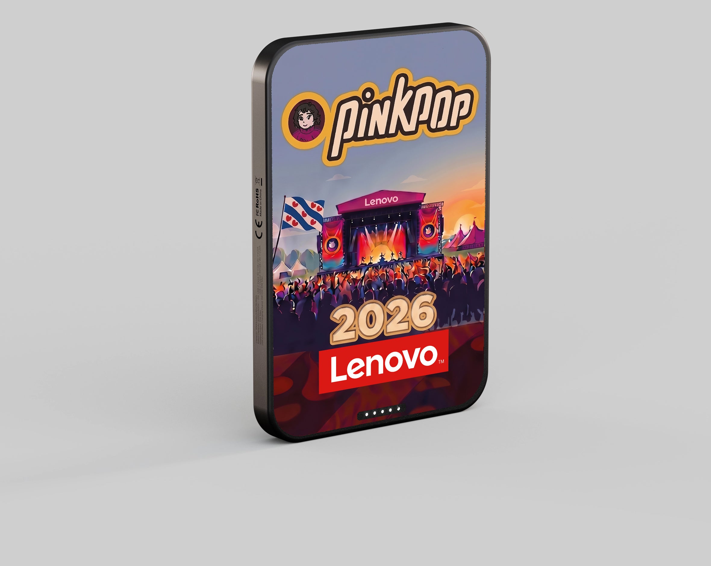 Customized Lenovo magnetic power bank attached to a smartphone at a festival.
