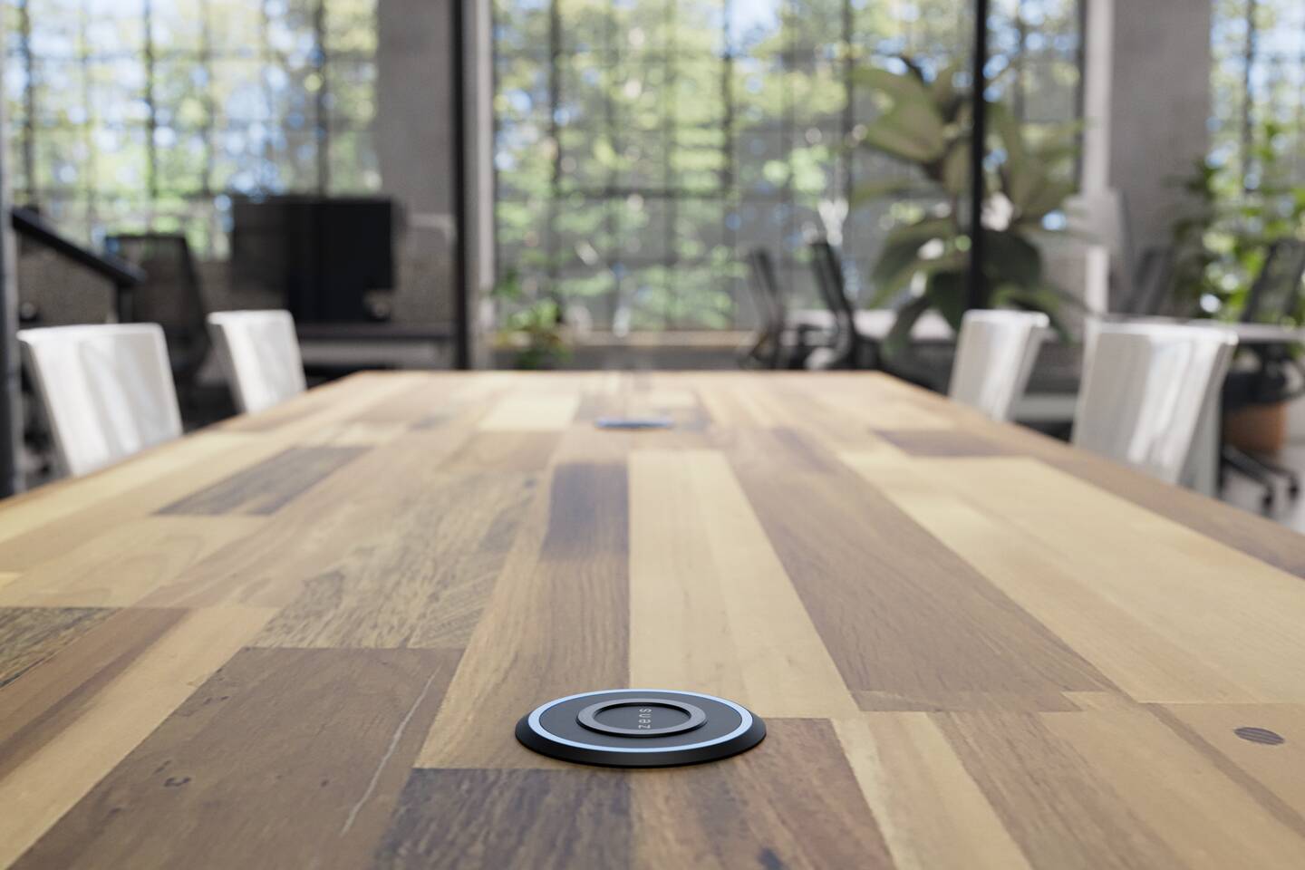 Built in wireless charger integrated into a modern workplace desk.