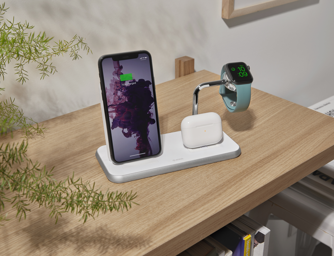Zens Stand Dock Watch Aluminium Wireless Charger charging a smartphone, AirPods and Apple Watch in a lifestyle setting with wireless and magnetic charging.