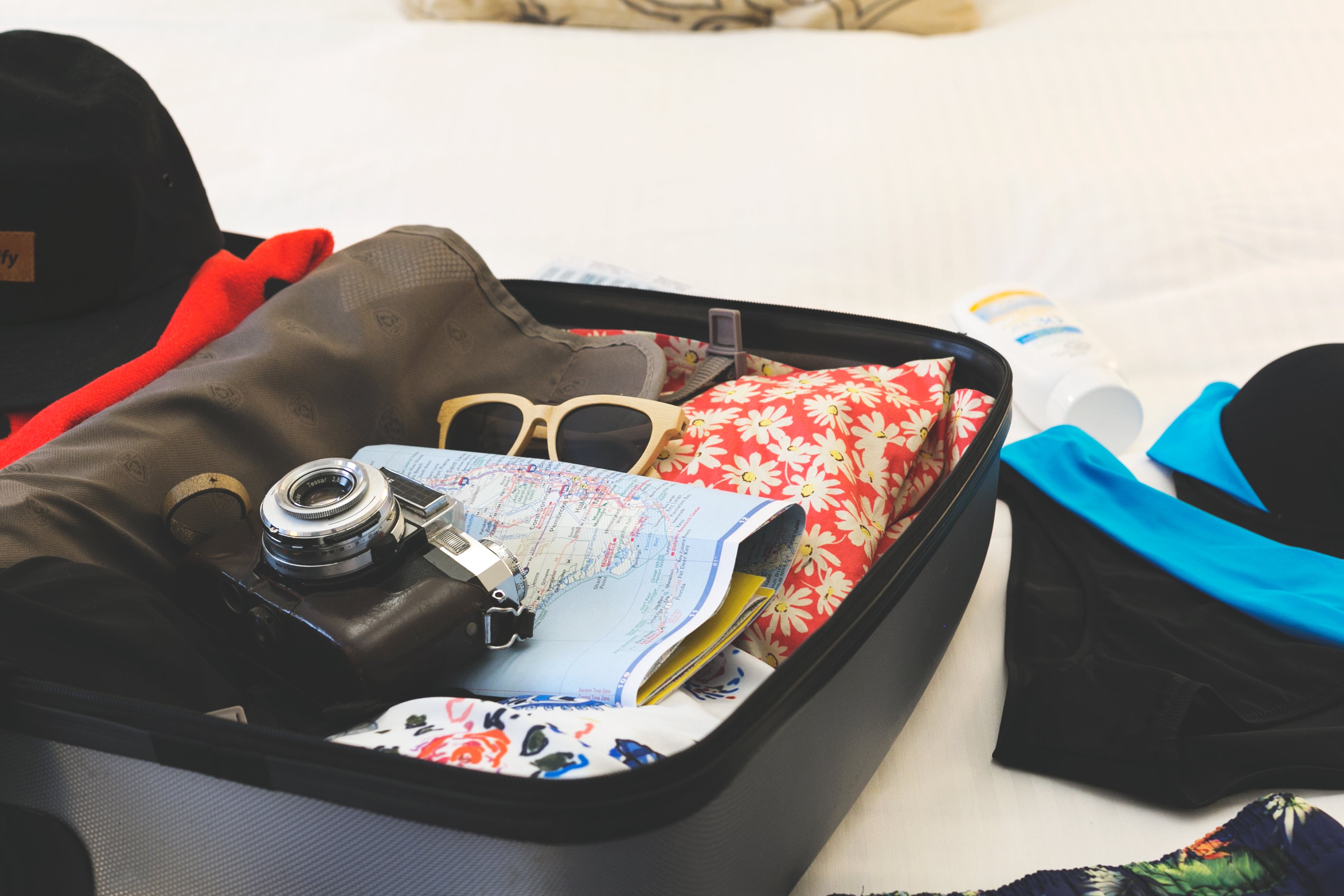 Packed holiday suitcase ready for travel.