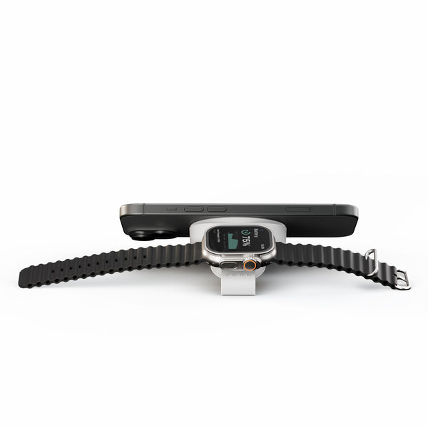 Black Zens Travel Charger Pro 2 wirelessly and magnetically charging a smartphone and watch.