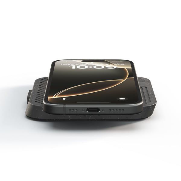 Zens Modular Single Wireless Charger Main Station magnetically and wirelessly charging a smartphone.
