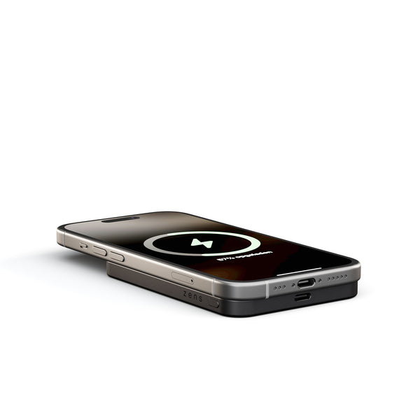 Zens Semi Solid State Powerbank wirelessly and magnetically charging a smartphone.