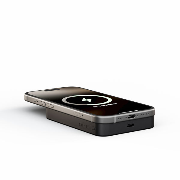 Zens Semi Solid State Powerbank wirelessly charging a smartphone with MagSafe.