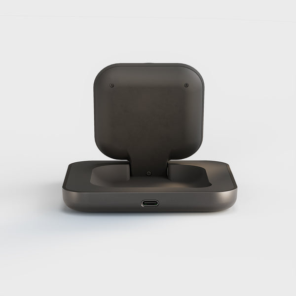 Zens Magnetic Nightstand Charger wirelessly and magnetically charging a smartphone displaying a clock.
