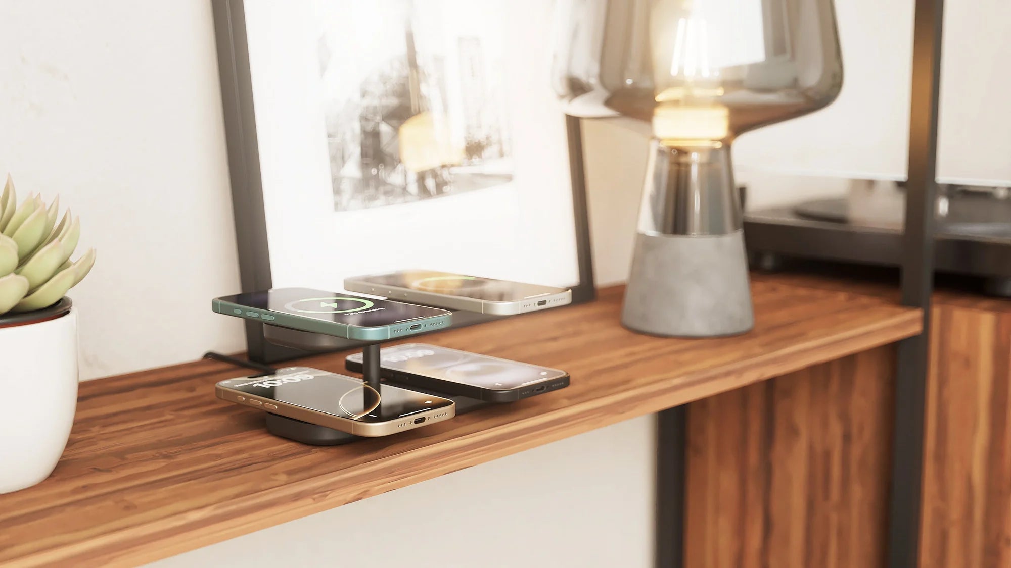 Quattro MagSafe Charger Pro 4 charging four smartphones in a lifestyle setting.