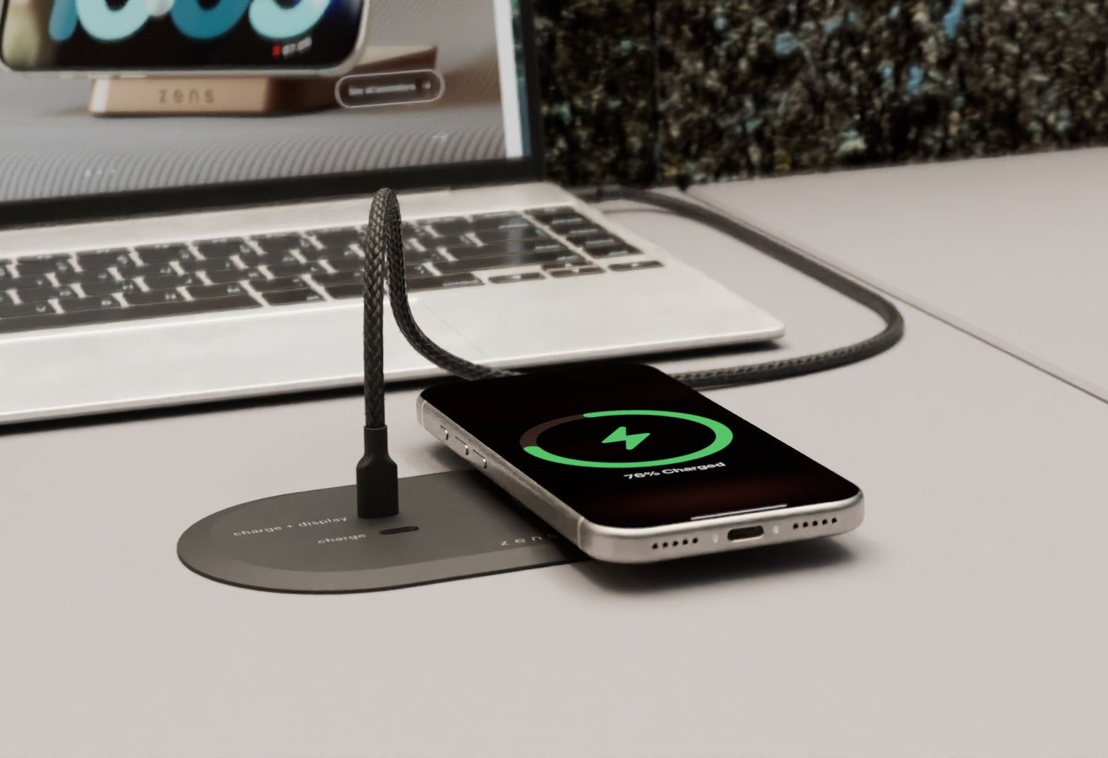 Zens PuK HDMI charging a smartphone with MagSafe and wireless charging in an office setting.