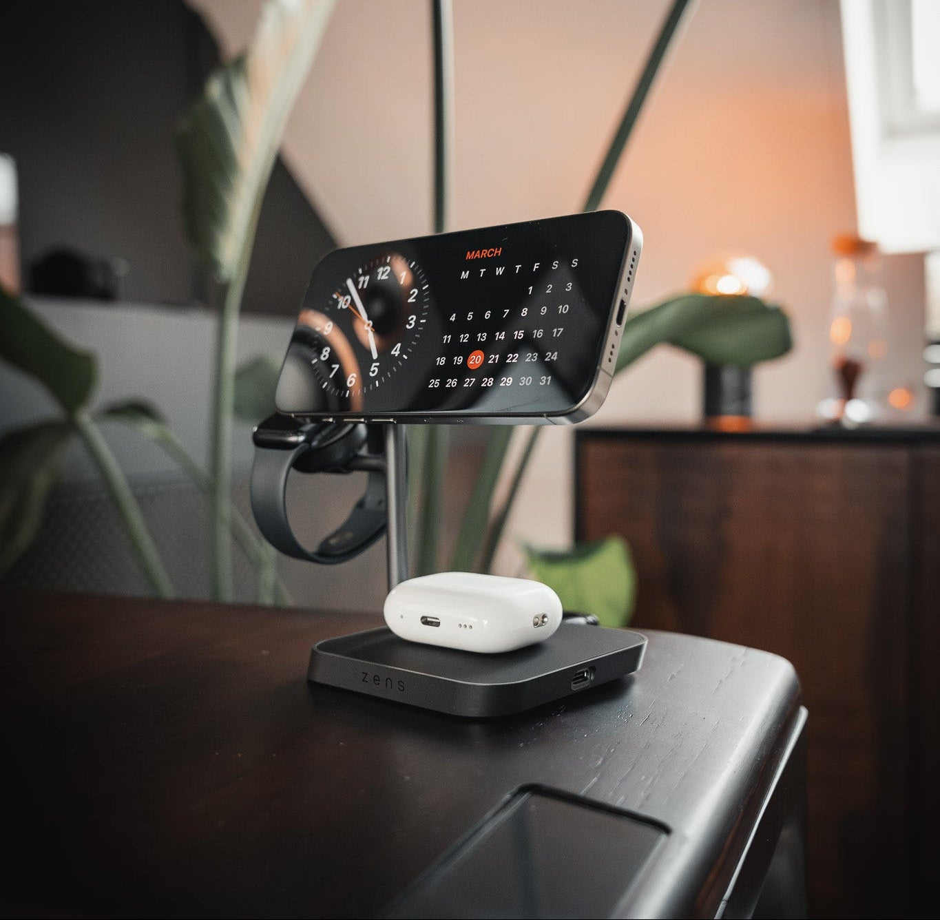 Zens Office Charger 3 wirelessly and magnetically charging a smartphone, AirPods and Apple Watch.