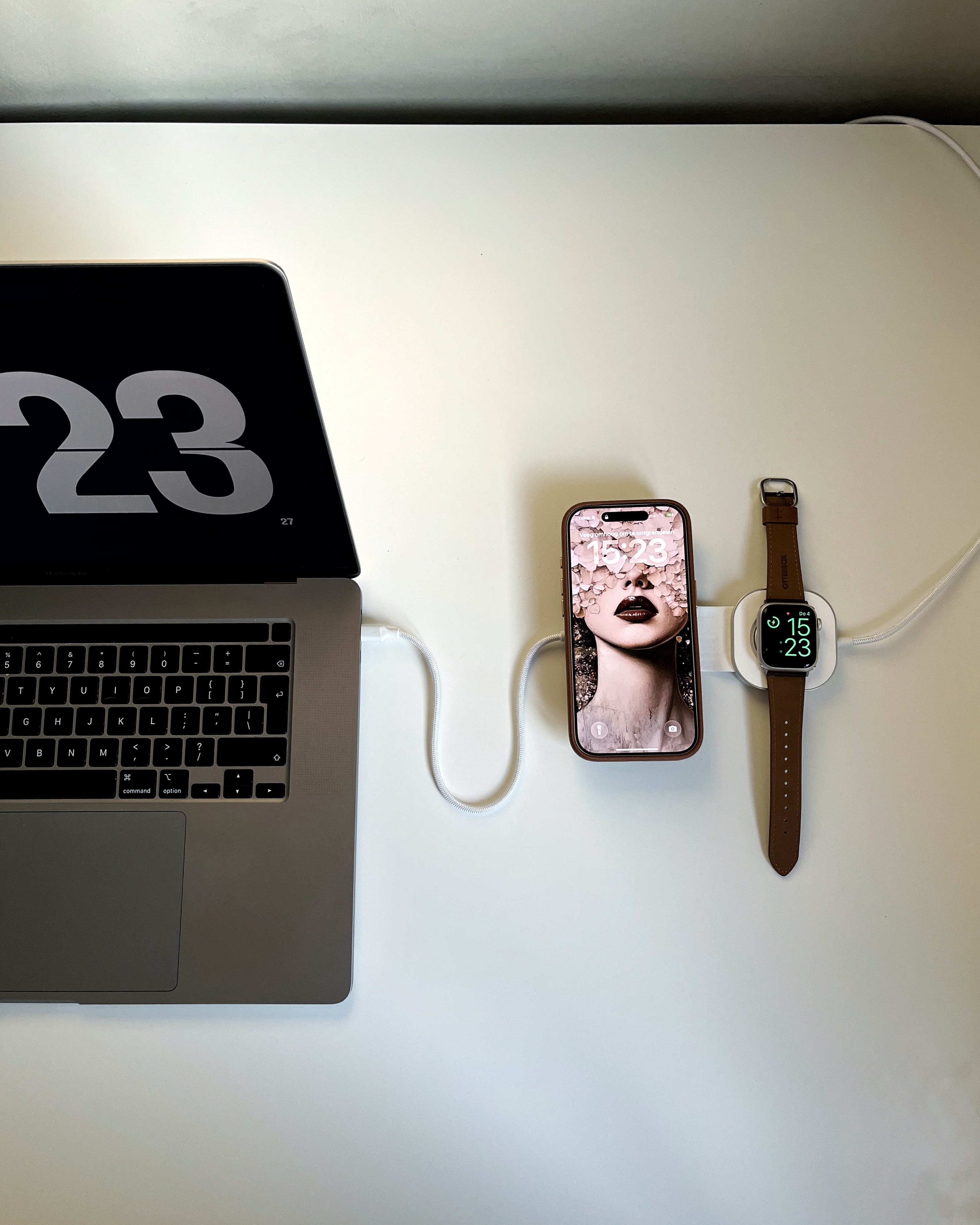 Zens Charging Cable USB C-C Pro 3 charging a laptop, smartphone and watch.