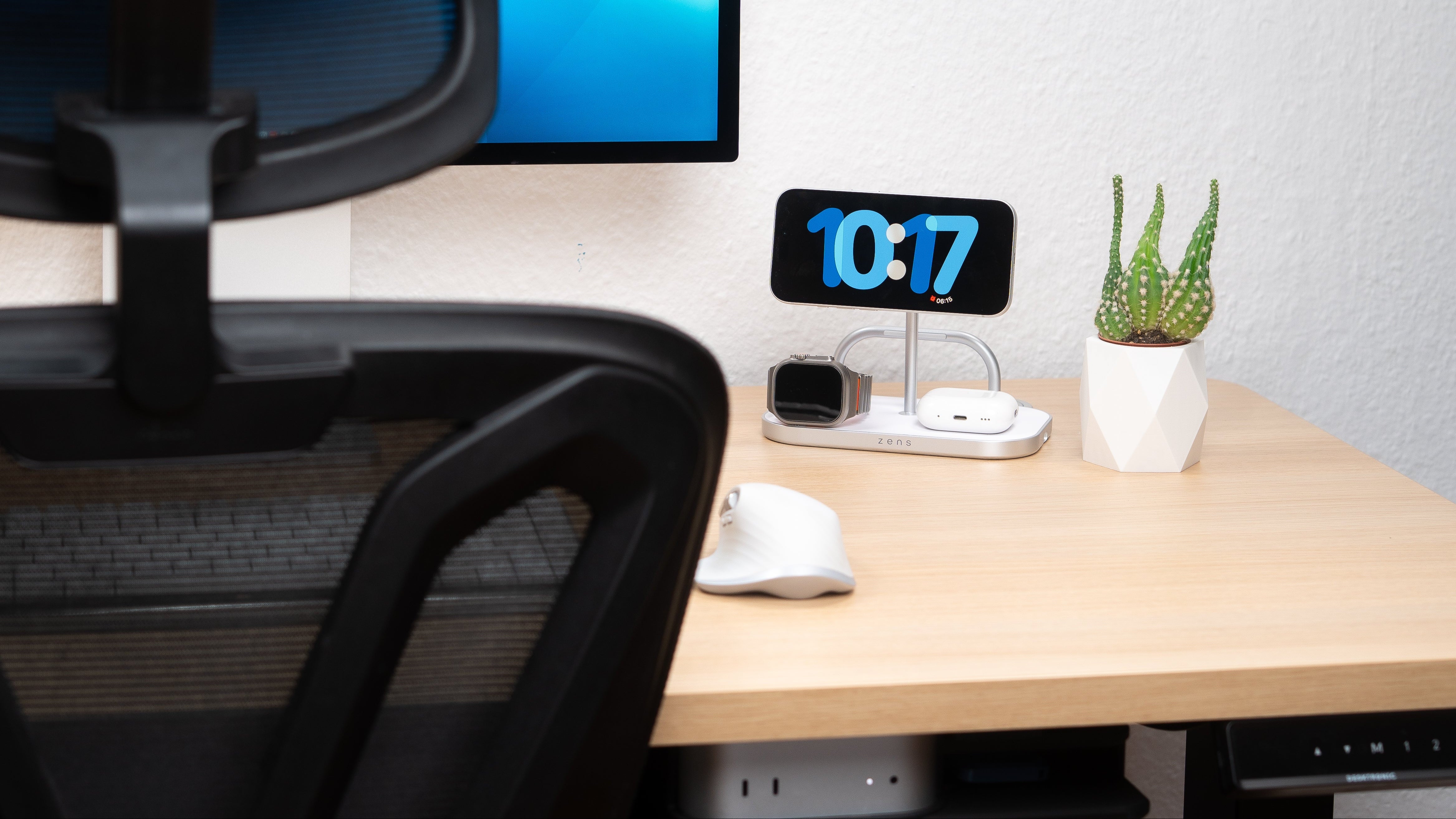 4 in 1 magnetic wireless charger charging an iPhone, AirPods, and Apple Watch in a lifestyle setting.