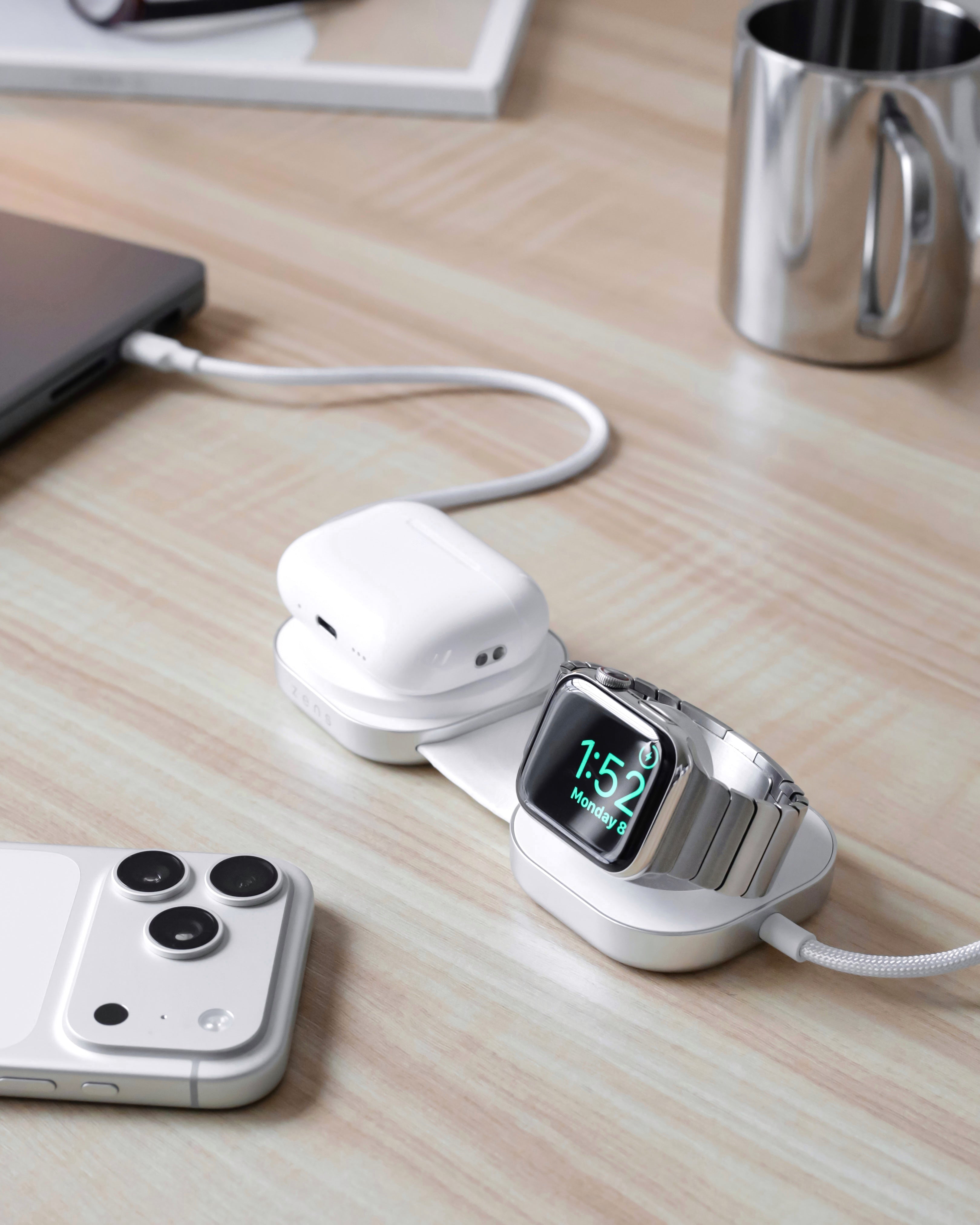 USB C Pro 3 charging cable charging wireless and magnetic a MacBook, Apple Watch, and smartphone in a lifestyle setting.