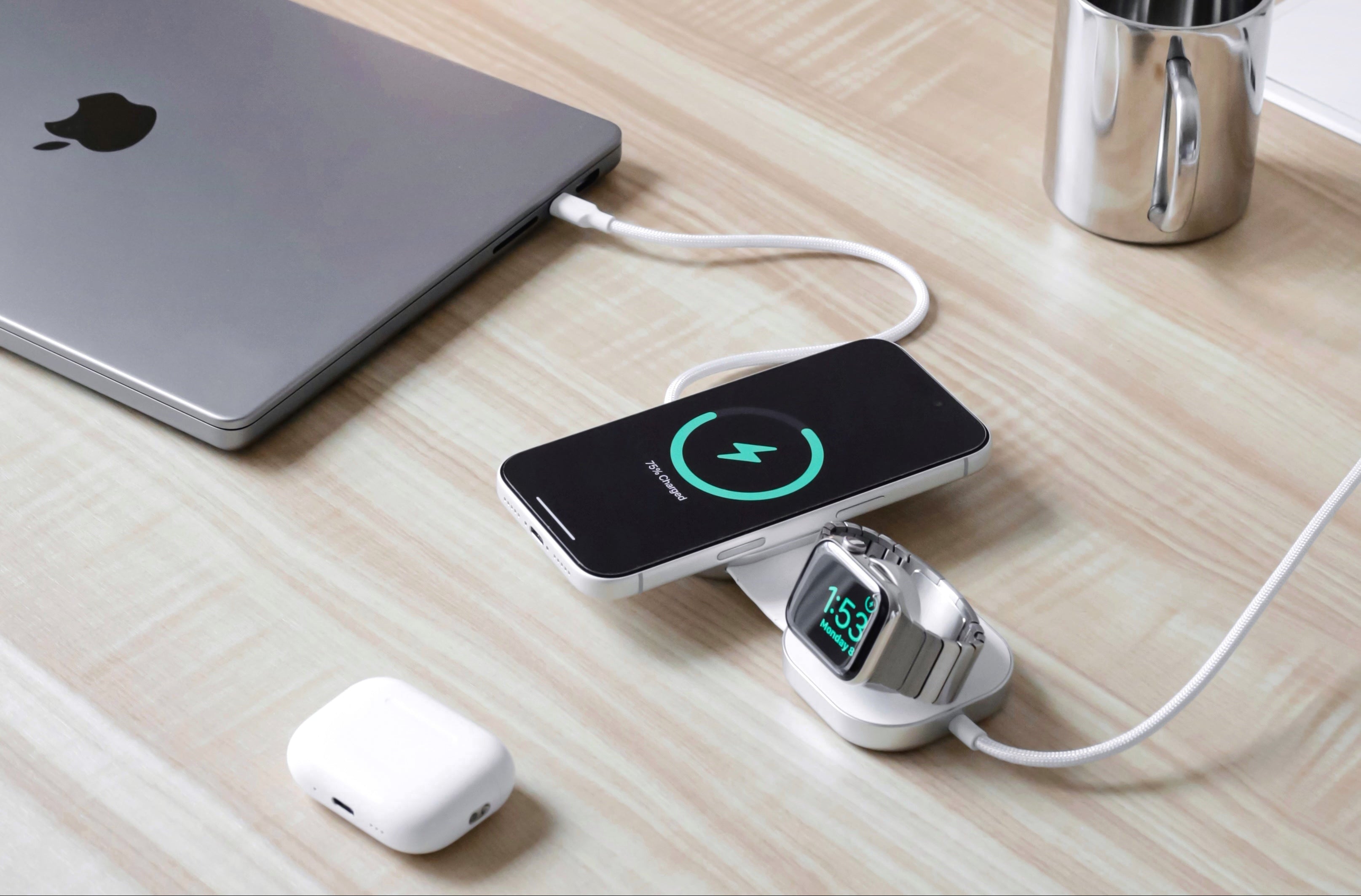 USB C Pro 3 charging cable charging magnetic and wireless a MacBook, Apple Watch, and smartphone in a lifestyle setting.