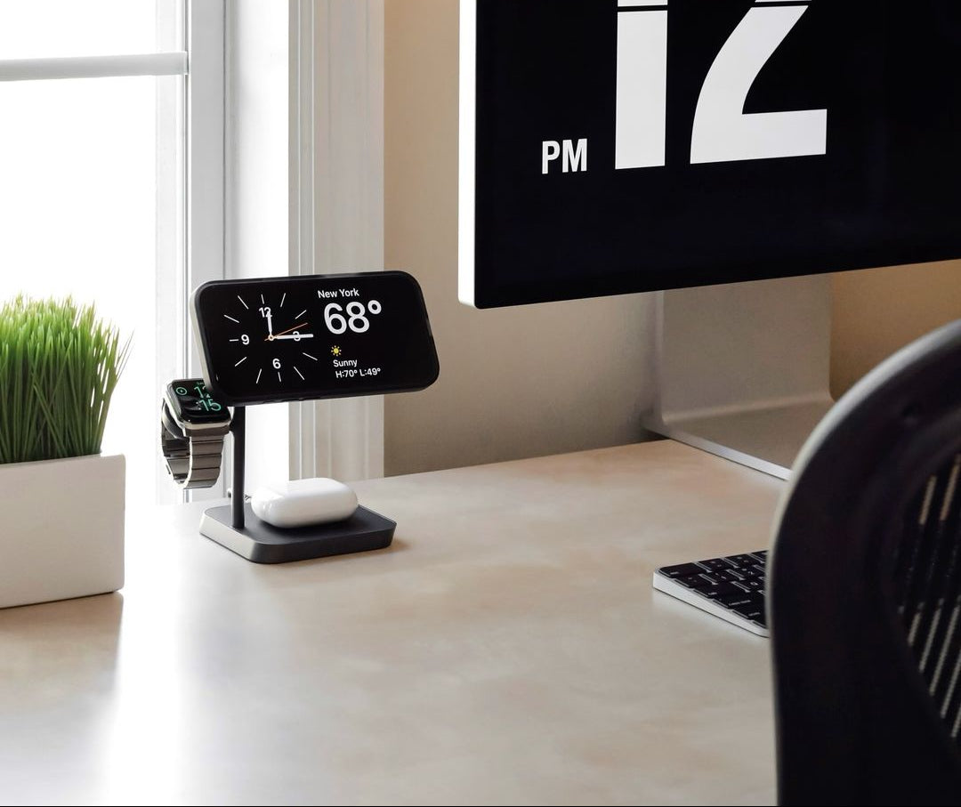 Zens Office Charger Pro 3 wirelessly and magnetically charging a smartphone, AirPods and watch in a lifestyle setting.