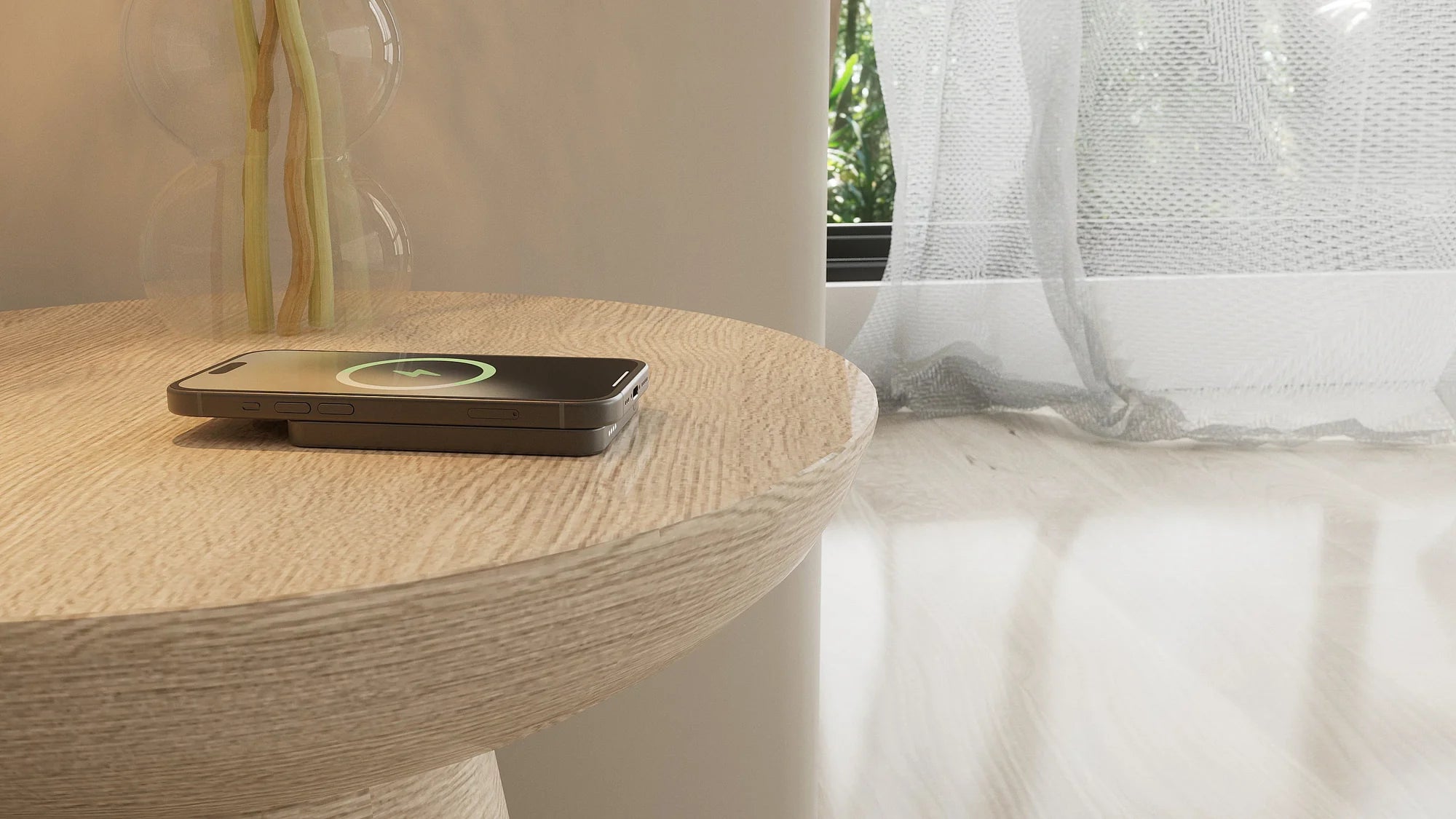Black MagSafe power bank charging a smartphone on a bedroom nightstand.