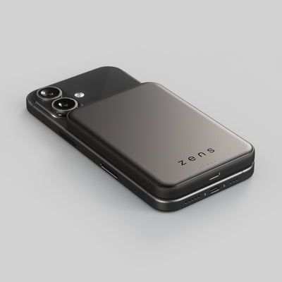 Zens magnetic powerbank charging an iPhone on a white background