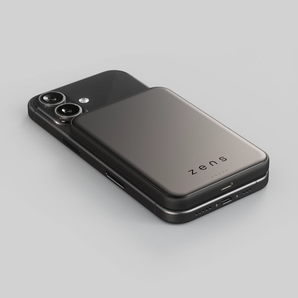 Zens magnetic powerbank charging an iPhone on a white background