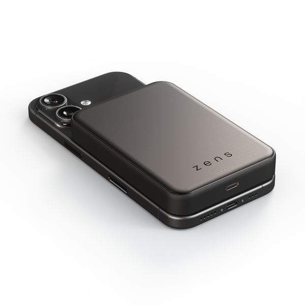 Zens semi solid MagSafe wireless powerbank charging an iPhone on a white background 