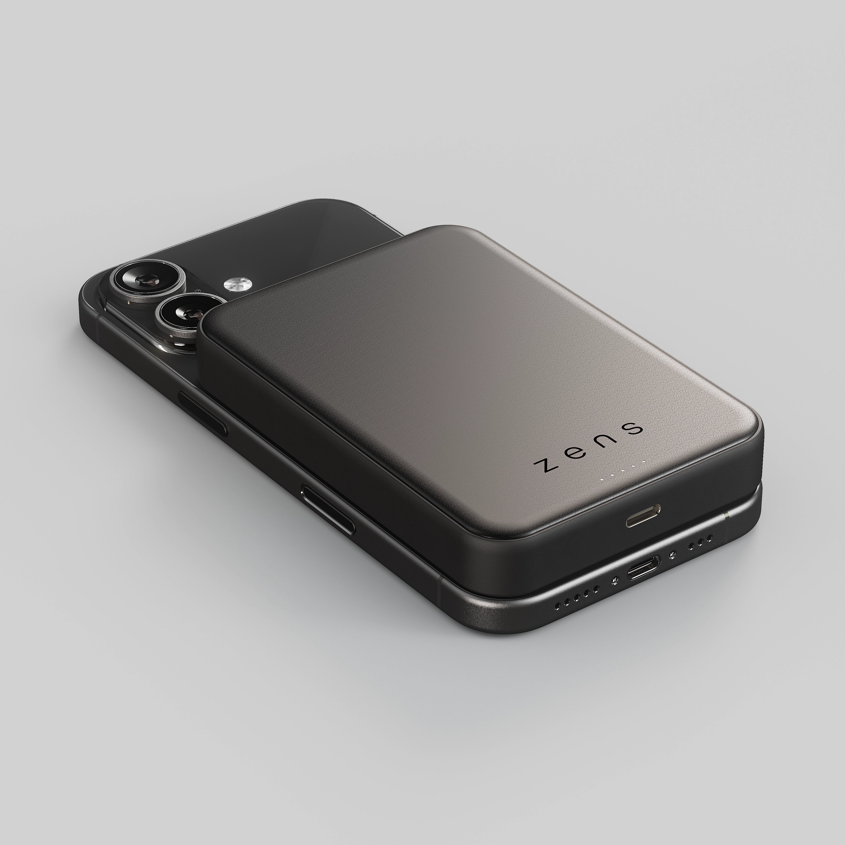 Zens semi solid MagSafe wireless powerbank charging an iPhone on a white background