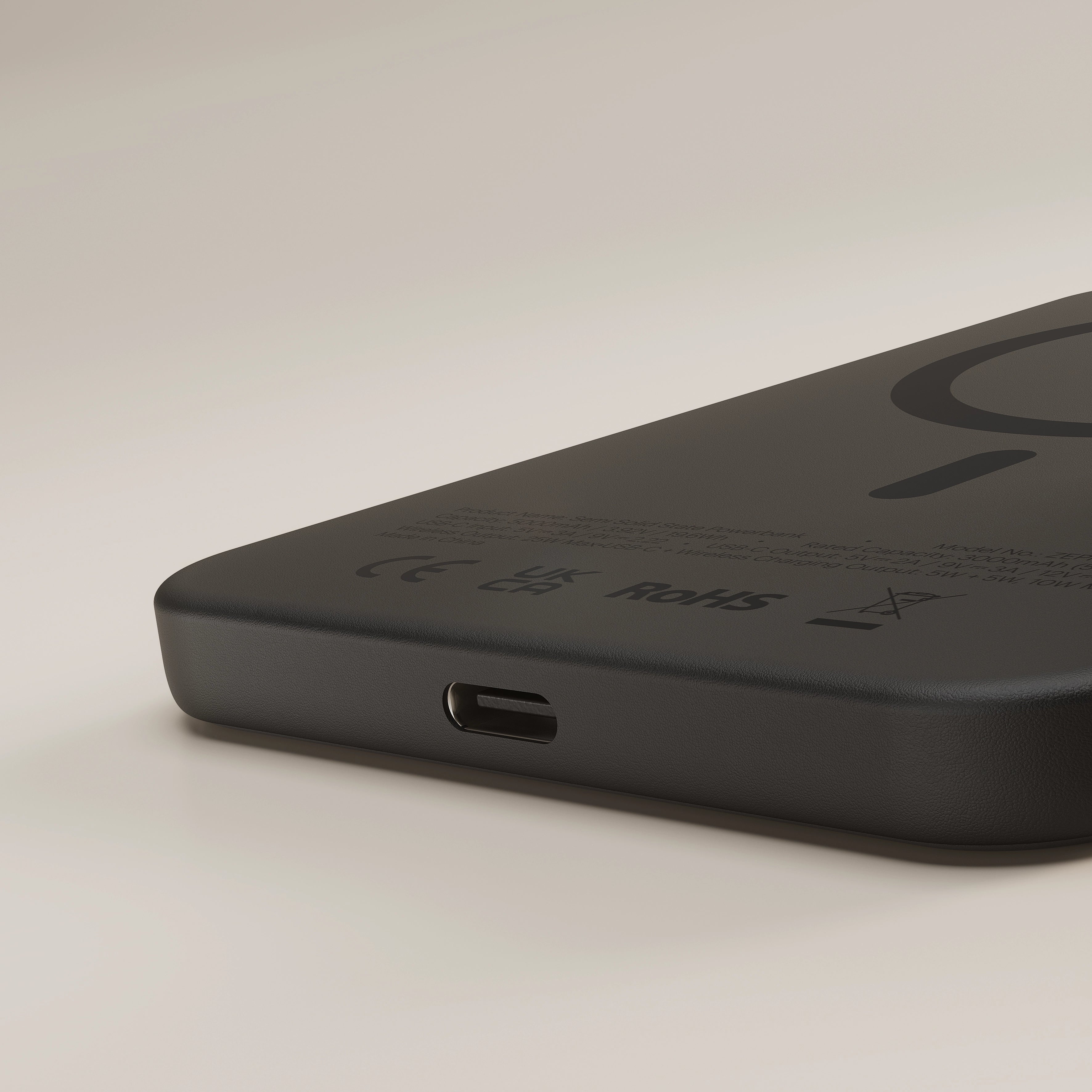 Close up of the black Zens magnetic wireless charger powerbank on a white background