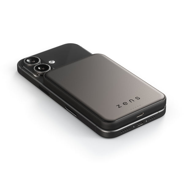 Zens semi solid MagSafe wireless powerbank charging an iPhone on a white background