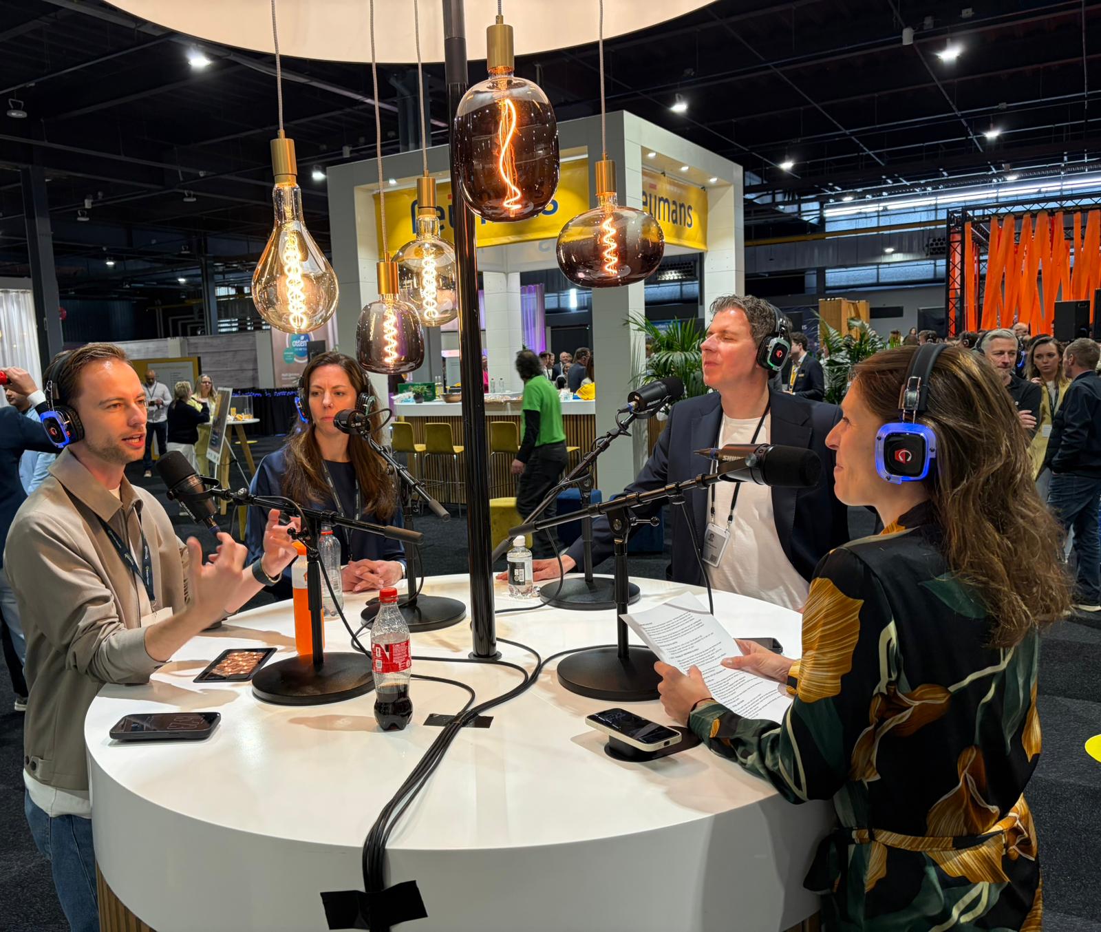 Ahrend Connect powered by Zens wireless charging solution in a podcast workplace experience setting.