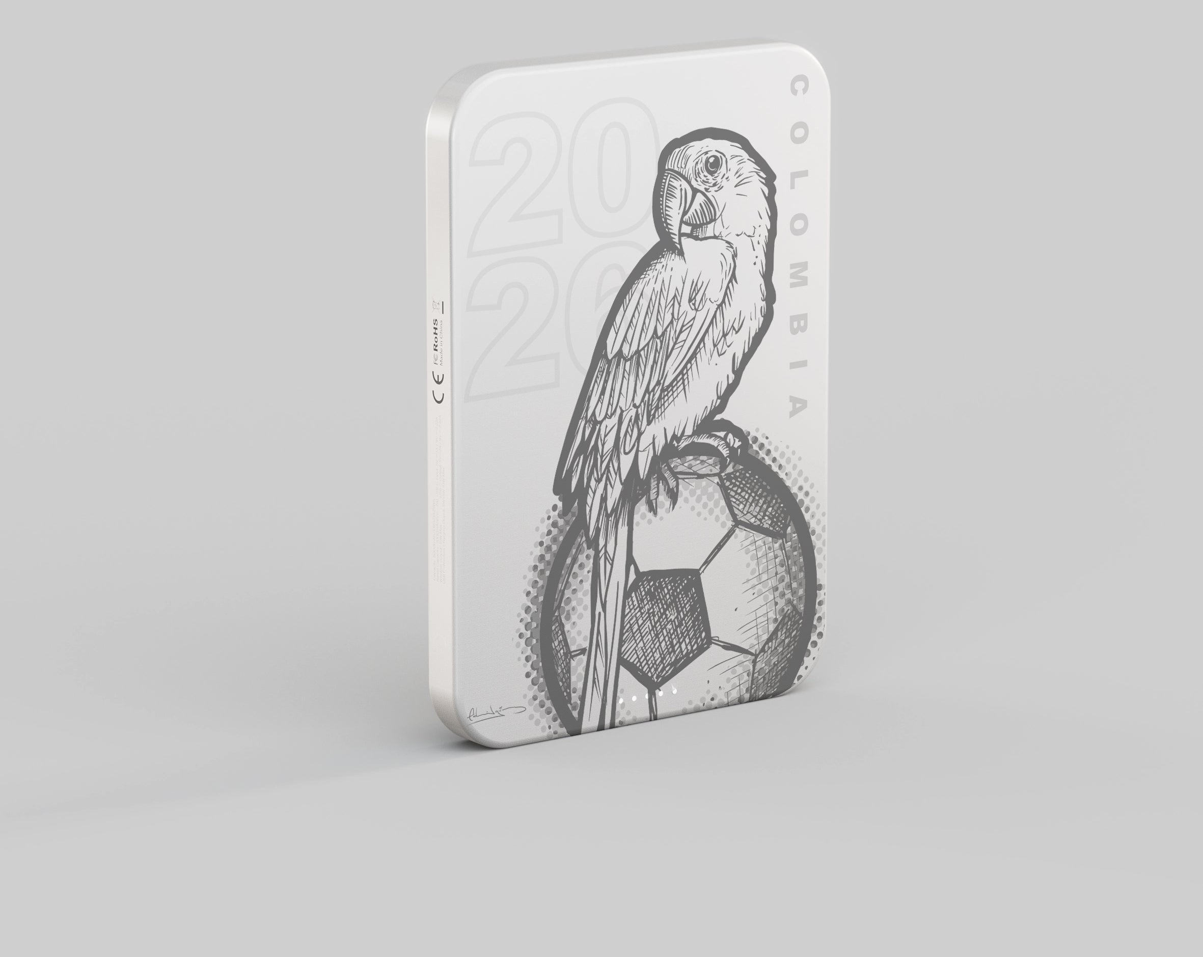 Customized engraved magnetic power bank with Columbia branding attached to a smartphone.