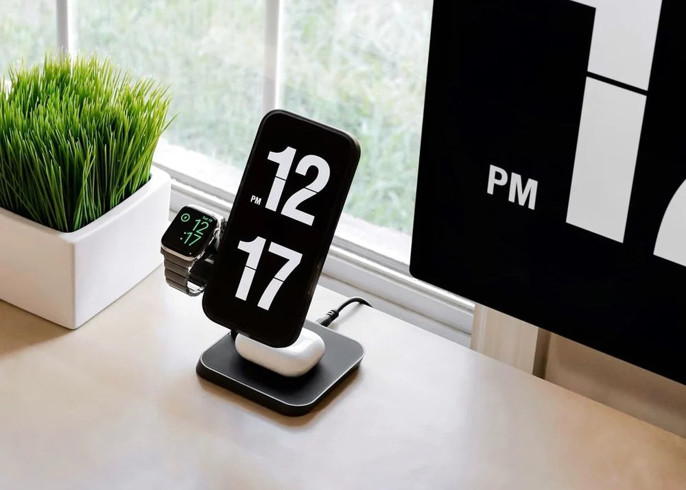 Zens Office Charger Pro 3 3 in 1 wireless charger charging an iPhone, Apple Watch and AirPods in an office setting