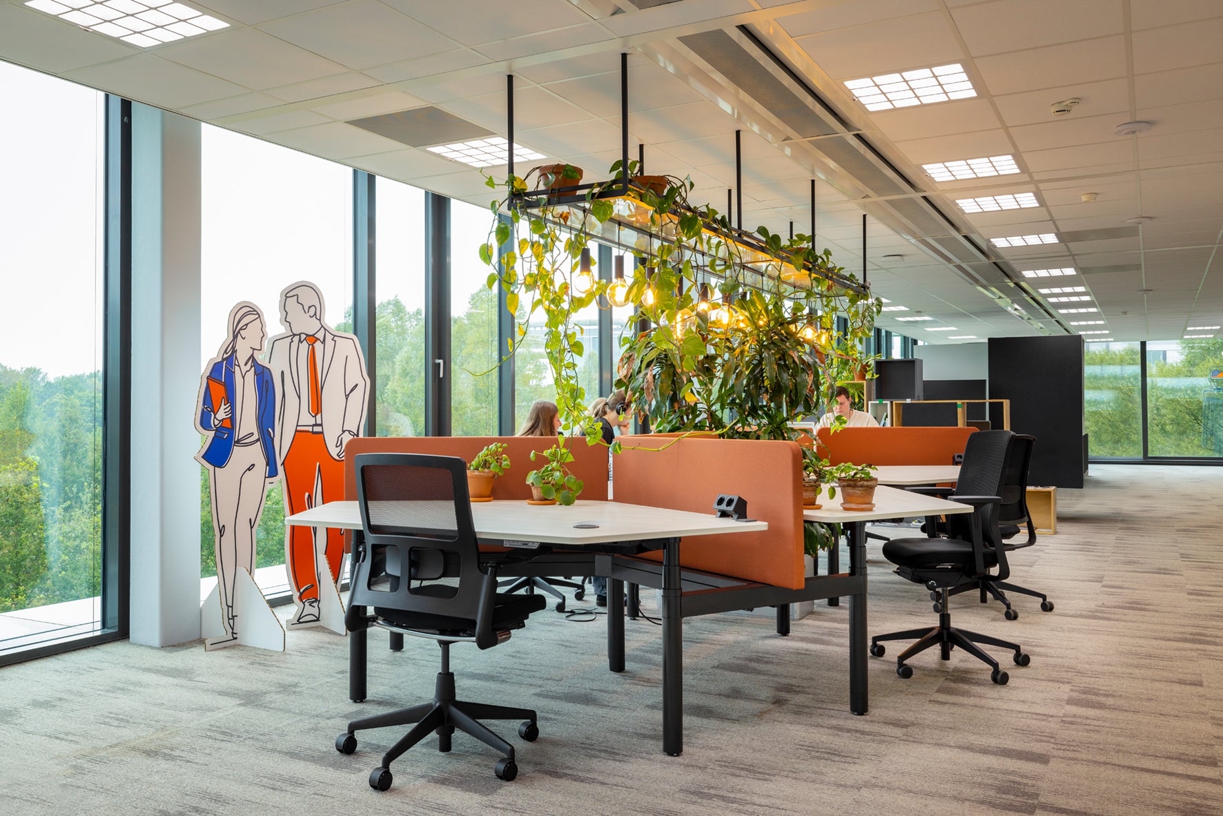 Workplace Vitality Hub with a built in wireless charger on a desk.